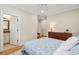 Comfortable bedroom boasts a view to the ensuite bathroom, with a ceiling fan overhead at 2645 Gnarled Pine, Seabrook Island, SC 29455
