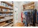 Spacious walk-in closet with custom shelving, rod space, and abundant storage options at 2645 Gnarled Pine, Seabrook Island, SC 29455