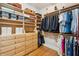 Organized walk-in closet featuring custom shelving and ample storage space for clothing at 2645 Gnarled Pine, Seabrook Island, SC 29455