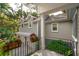 Home exterior featuring a two-car garage with black hardware and potted plants at 2645 Gnarled Pine, Seabrook Island, SC 29455