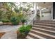 View of the home's exterior, with steps to the front door and view of the two car garage at 2645 Gnarled Pine, Seabrook Island, SC 29455