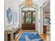 Beautiful foyer featuring an arched front door, artwork and hardwood floors at 2645 Gnarled Pine, Seabrook Island, SC 29455