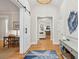 Inviting foyer boasting hardwood floors, a barn door, and stylish decor at 2645 Gnarled Pine, Seabrook Island, SC 29455