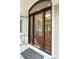 Stunning entryway with a dark wood front door, sidelights and transom at 2645 Gnarled Pine, Seabrook Island, SC 29455