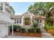 Welcoming front entrance with landscaped garden, steps and a two-car garage at 2645 Gnarled Pine, Seabrook Island, SC 29455