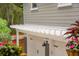 Attached garage featuring carriage doors, a pergola, and exterior lighting at 2645 Gnarled Pine, Seabrook Island, SC 29455