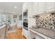 Gourmet kitchen with stainless steel appliances, granite countertops, and access to the formal dining room at 2645 Gnarled Pine, Seabrook Island, SC 29455