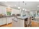 Open kitchen with stainless steel appliances, granite countertops, island with seating, and breakfast nook at 2645 Gnarled Pine, Seabrook Island, SC 29455