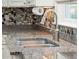 Close-up of stainless steel faucet and granite countertop with tile backsplash at 2645 Gnarled Pine, Seabrook Island, SC 29455