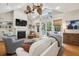 Spacious living room with a fireplace, hardwood floors, and patio access at 2645 Gnarled Pine, Seabrook Island, SC 29455