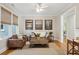 Cozy living room with a leather furniture, neutral walls, and modern decor at 2645 Gnarled Pine, Seabrook Island, SC 29455