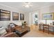 Comfortable living room showcasing neutral walls, and hardwood floors at 2645 Gnarled Pine, Seabrook Island, SC 29455