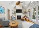 Inviting living room features a fireplace, built-in shelving, and natural light from the deck entrance at 2645 Gnarled Pine, Seabrook Island, SC 29455