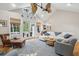 Bright living room boasts a vaulted ceiling, ceiling fan, and access to the outdoor deck at 2645 Gnarled Pine, Seabrook Island, SC 29455