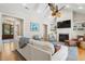 Cozy living room with a fireplace, built-in shelving, and stylish decor for a comfortable ambiance at 2645 Gnarled Pine, Seabrook Island, SC 29455