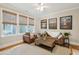 Inviting living room featuring a leather sofa, neutral walls, and window coverings at 2645 Gnarled Pine, Seabrook Island, SC 29455