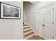 Inviting stairway with carpeted steps, leading to a double door and showcasing neutral decor at 2645 Gnarled Pine, Seabrook Island, SC 29455