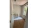 The bathroom features white cabinets, tile flooring, and natural light at 2706 Old Oak Walk, Seabrook Island, SC 29455
