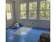 The bedroom has lots of windows offering ample natural light at 2706 Old Oak Walk, Seabrook Island, SC 29455