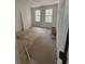 Unfinished bedroom with light wood flooring, two windows, and bright natural light at 2706 Old Oak Walk, Seabrook Island, SC 29455