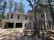 Two-story home with steps leading up to covered entry and open garage space at 2706 Old Oak Walk, Seabrook Island, SC 29455