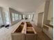 Spacious kitchen featuring a large island, lots of natural light, and modern cabinets at 2706 Old Oak Walk, Seabrook Island, SC 29455