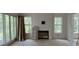 Living room featuring a fireplace with multiple windows for natural light at 2706 Old Oak Walk, Seabrook Island, SC 29455
