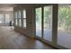 Bright living room with large windows and sliding glass doors leading to outdoor deck at 2706 Old Oak Walk, Seabrook Island, SC 29455