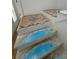 Wood herringbone flooring is being installed on the staircase landing at 2706 Old Oak Walk, Seabrook Island, SC 29455