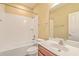 Bathroom with white tiled shower-tub combo, vanity sink, and ample natural light at 271 Village Stone Cir, Summerville, SC 29486