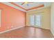 Bright bedroom with hardwood floors, a ceiling fan, and access to a private outdoor patio at 271 Village Stone Cir, Summerville, SC 29486