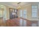 Dining area with hardwood flooring, a built-in bar, and stylish pendant lighting at 271 Village Stone Cir, Summerville, SC 29486