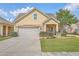 Charming home with a two-car garage, well-manicured lawn, and attractive landscaping at 271 Village Stone Cir, Summerville, SC 29486