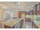 Open concept kitchen with a large granite island, stainless steel appliances, and pendant lighting at 271 Village Stone Cir, Summerville, SC 29486