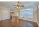 Open-concept living room with hardwood floors, crown molding, and seamless flow into the kitchen at 271 Village Stone Cir, Summerville, SC 29486