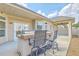 Covered patio with bar seating area features a built-in grill, perfect for entertaining Gathering and friends at 271 Village Stone Cir, Summerville, SC 29486