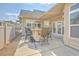 A covered patio with a built-in table and chairs offers an inviting outdoor space for dining and socializing at 271 Village Stone Cir, Summerville, SC 29486