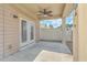 Covered patio with a ceiling fan and access to the backyard through double doors at 271 Village Stone Cir, Summerville, SC 29486