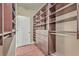 Spacious walk-in closet with custom shelving, drawers, and ample storage space for an organized wardrobe at 271 Village Stone Cir, Summerville, SC 29486