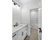 Modern bathroom featuring white cabinetry, marble countertop, and shower with white subway tile at 2725 Starfish Dr, Johns Island, SC 29455
