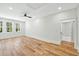 Bedroom featuring hardwood floors, three large windows, and white trim at 2725 Starfish Dr, Johns Island, SC 29455