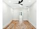 Bright bedroom with hardwood floors, white walls, and a ceiling fan at 2725 Starfish Dr, Johns Island, SC 29455