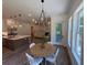 Dining area open to kitchen featuring a wooden table and many windows at 2725 Starfish Dr, Johns Island, SC 29455