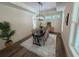 Well-lit dining room features a long table, modern light fixture, and a decorative plant at 2725 Starfish Dr, Johns Island, SC 29455