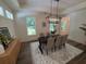 Dining room area with modern table and chair set and decorative light fixture at 2725 Starfish Dr, Johns Island, SC 29455