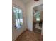 Front door entryway with brick flooring, leading to dining room with view to the outside at 2725 Starfish Dr, Johns Island, SC 29455