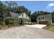Inviting home with a well-manicured lawn and a long driveway to a detached garage at 2725 Starfish Dr, Johns Island, SC 29455