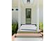 Welcoming entrance with a green door framed by white pillars, offering a glimpse of sophisticated design at 2725 Starfish Dr, Johns Island, SC 29455