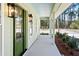 Inviting front porch with green door and stylish lanterns, offering a charming entrance to the home at 2725 Starfish Dr, Johns Island, SC 29455