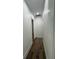 Clean, modern hallway with hardwood floors and neutral walls at 2725 Starfish Dr, Johns Island, SC 29455
